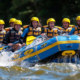 a thrilling rafting expedition unfolds on the turbulent waters of the middle ocoee river, showcasing a diverse group of adventurers navigating the frothy rapids in vibrant inflatable rafts, amidst a backdrop of rugged riverbanks and dynamic water splashes.