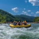 a dynamic whitewater rafting scene on the ocoee river showcases exhilarating rapids under a clear blue sky, capturing the thrill and adventure of labor day weekend.