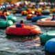 a vibrant river tubing adventure scene unfolds with colorful rafts filled with exhilarated adventurers navigating a lively river, framed by safety gear and equipment meticulously arranged on the riverbank for a thrilling yet secure experience.