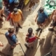 a dynamic urban setting captures a group of adventurers animatedly planning their weekend white water rafting trip, surrounded by sleek kayaks and gear in a bustling outdoor gear shop.